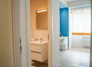 a bathroom with a sink and a mirror at Sogna Firenze apartments in Florence +9 photos