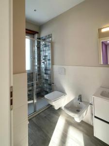 a bathroom with a toilet and a sink and a shower at Sogna Firenze apartments in Florence