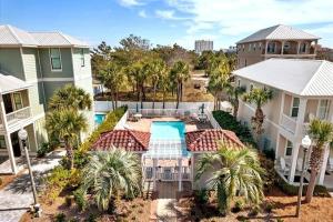 an aerial view of a house with a swimming pool at Coastal91 Free Golf Cart Gated Beach Access in Destin