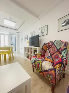 a living room with a couch and a table at AT Paseo Ficus Centenario in Almería