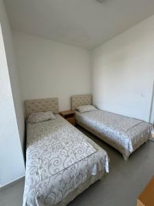 Ένα ή περισσότερα κρεβάτια σε δωμάτιο στο Apartmani ZMS