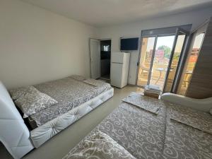 Ένα ή περισσότερα κρεβάτια σε δωμάτιο στο Apartmani ZMS