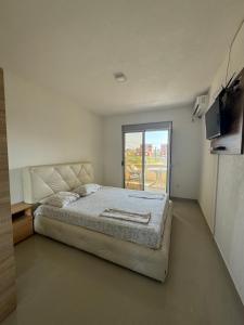Ένα ή περισσότερα κρεβάτια σε δωμάτιο στο Apartmani ZMS