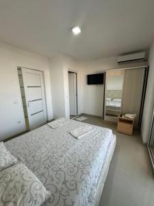 Ένα ή περισσότερα κρεβάτια σε δωμάτιο στο Apartmani ZMS