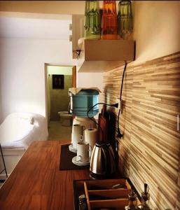 a kitchen with a counter top with a coffee maker on it at vivestadias in San Gregorio