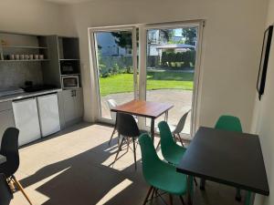 a kitchen and dining room with a table and chairs at Costa Mielno in Mielno