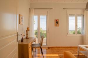 a home office with a desk and a window at Country House Pidasos in Pídhasos +38 photos