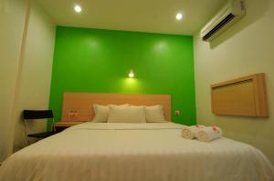 Postel nebo postele na pokoji v ubytování T Hotel Changlun