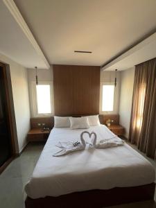 Letto o letti in una camera di Gaia Pyramids View INN