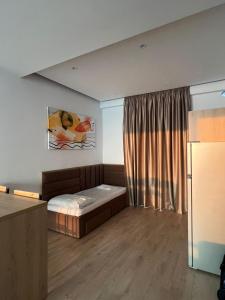 Postel nebo postele na pokoji v ubytování NK Residence