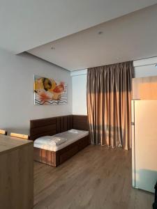 Postel nebo postele na pokoji v ubytování NK Residence