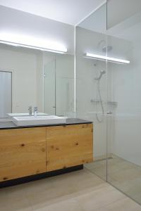 
a bathroom with a sink and a mirror at Hotel zum Goldenen Schiff in Enns
