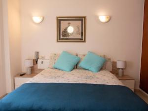 Ένα ή περισσότερα κρεβάτια σε δωμάτιο στο Còmode apartament al bell mig de Girona