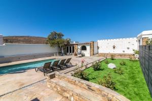 an image of a backyard with a swimming pool at Windmill Villa in Tinos in Agios Sostis