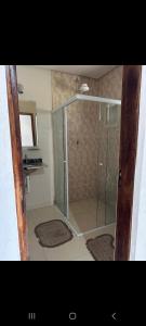 a shower with a glass door in a bathroom at Recanto Videira Rota do Vinho in São Roque +34 photos