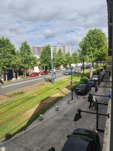 a view of a street with cars parked on the road at Cosy Duplex proche Paris in Épinay-sur-Seine