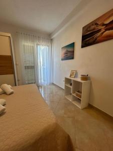 Postel nebo postele na pokoji v ubytování Apartmani Palada