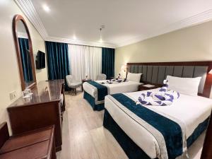 A bed or beds in a room at Hapi V