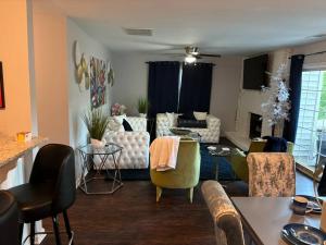 a living room with a couch and chairs at 3 bed 3 bath home Dtown Gainesville in Gainesville