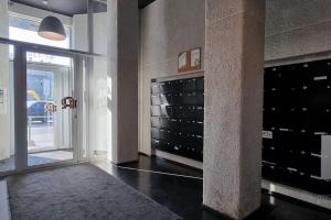 a room with a wall with a bunch of wine cabinets at Charming flat next to Old Town and Harbor in Tallinn