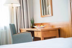 Voodi või voodid majutusasutuse HOTEL POST alpine cityflair toas
