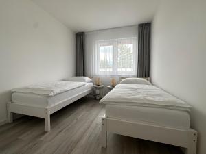 Posteľ alebo postele v izbe v ubytovaní LAWIS Apartments