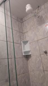 a bathroom with a shower with a toilet in it at Casa simples Natal Luz e FIG in Garanhuns