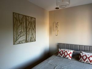 Ένα ή περισσότερα κρεβάτια σε δωμάτιο στο Appartement 2 pièces wifi climatisation