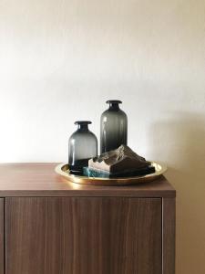 two glass vases sitting on top of a table at Hotel Trinserhof in Trins