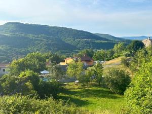 a view of a village with mountains in the background at Terra Verde in Račički Brijeg