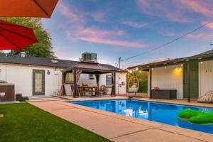 a house with a swimming pool in a yard at Designer Home with Guest House, Pool, Hot Tub in Tucson