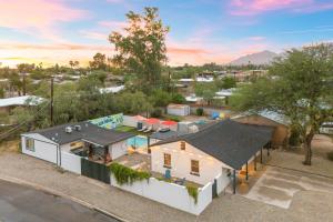 an overhead view of a white house with a yard at Designer Home with Guest House, Pool, Hot Tub in Tucson