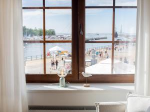 a window in a room with a view of a beach at MERSEA in Ustka