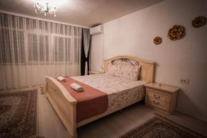 Postel nebo postele na pokoji v ubytování Prishtina Guests