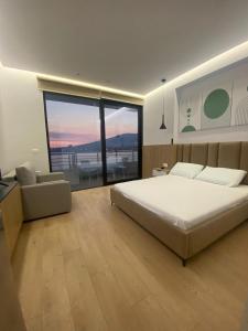Postel nebo postele na pokoji v ubytování NK Residence