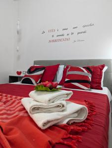 Postel nebo postele na pokoji v ubytování I colori della Sicilia