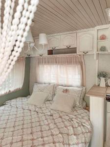 a bedroom with a large bed in a room at Каравана GYPSY in Chernomorets +21 photos