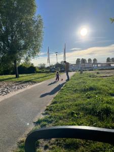a man and a child walking down a road at Alaa in Bad Fallingbostel +3 photos