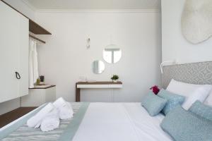 Postel nebo postele na pokoji v ubytování Aurora - Rooms & Suites - Spetses
