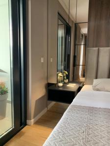 Ein Bett oder Betten in einem Zimmer der Unterkunft Capitol Suites Exclusive