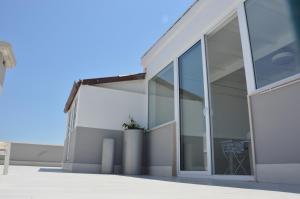 an open door of a house with a potted plant at Marimar Apartment in Bari +31 photos