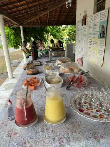 a table with many different types of food on it at POUSADA PARAÍSO CULTURAL in Barreirinhas