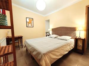 a bedroom with a large bed and a ladder at Aix en Provence charmante villa piscine cadre verdoyant 6 personnes in Aix-en-Provence