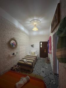Postel nebo postele na pokoji v ubytování Riad Al Borj