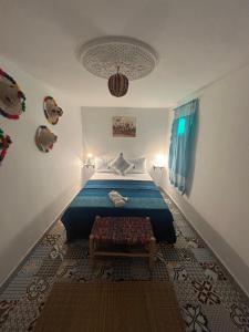 Postel nebo postele na pokoji v ubytování Riad Al Borj