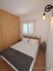 Posteľ alebo postele v izbe v ubytovaní Formentera suite 14