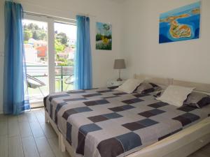 Postel nebo postele na pokoji v ubytování Apartments Grubisin