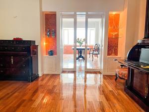 a living room with a table and a dining room at Spacious, Luxurious, and Charming Apartment in Premium Porto Location with PARKING in Porto