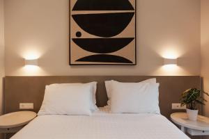A bed or beds in a room at Ariadne Suites