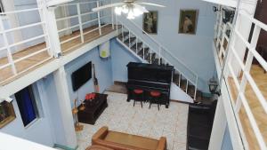 an overhead view of a living room with a piano at Hostal Bahía, habitaciones en pleno centro y a pasos de la playa in Iquique